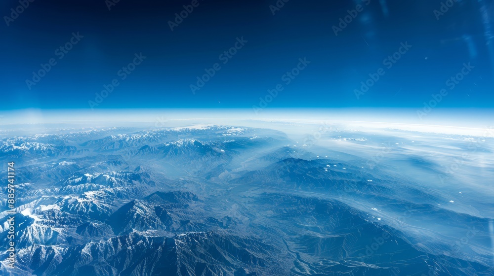 A high-altitude view of the Earth from an airplane window, providing a breathtaking perspective with room for text A high-altitude view of the Earth from an airplane window, providing a breathtaking perspective with room for text