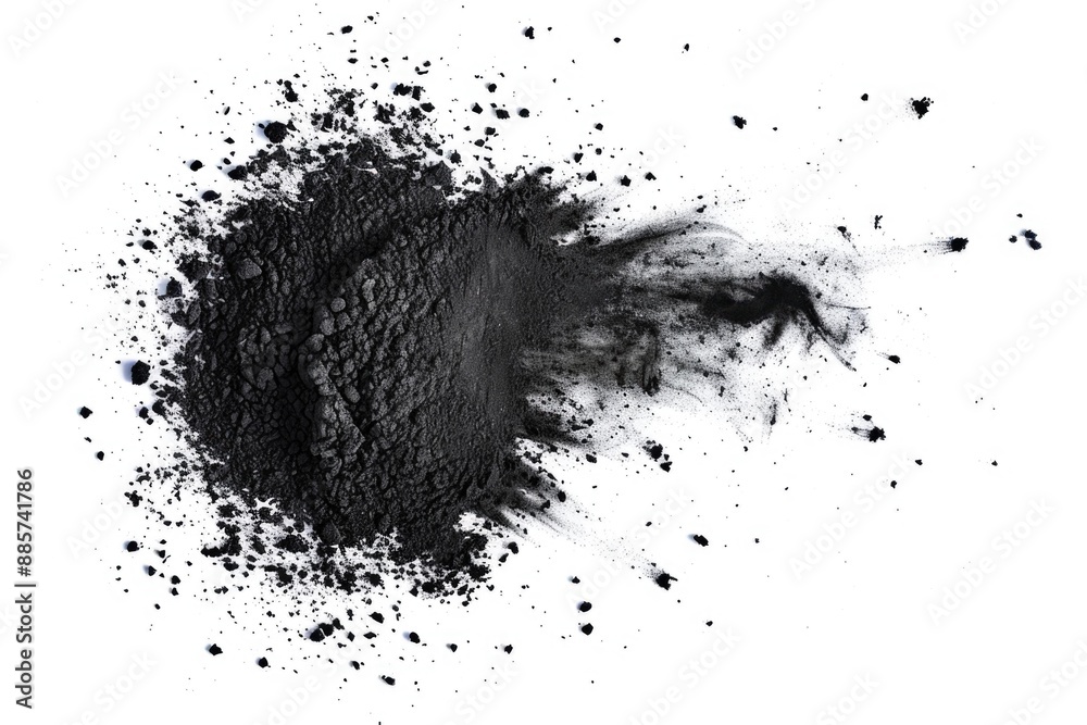 A close-up view of a pile of black powder on a white background A close-up view of a pile of black powder on a white background