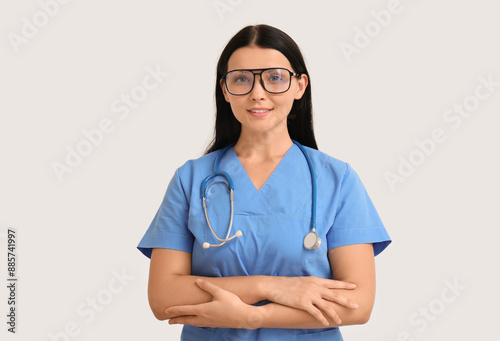 Female doctor on light back...