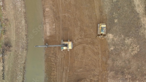 Canvas Print Aerial of Two Excavator working strengthening of the River Outlet from the Banks