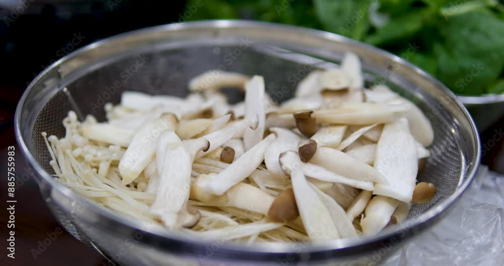 Edible sliced champignon mushrooms on a paper kitchen surface. Rotation Edible sliced champignon mushrooms on a paper kitchen surface. Rotation