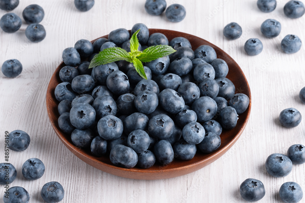 Fresh blueberries on a wooden white table Fresh blueberries on a wooden white table