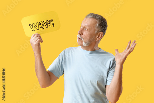 Shocked senior man holding ...