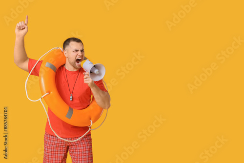 Young lifeguard with lifebu...