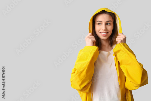 Young pretty woman in rainc...