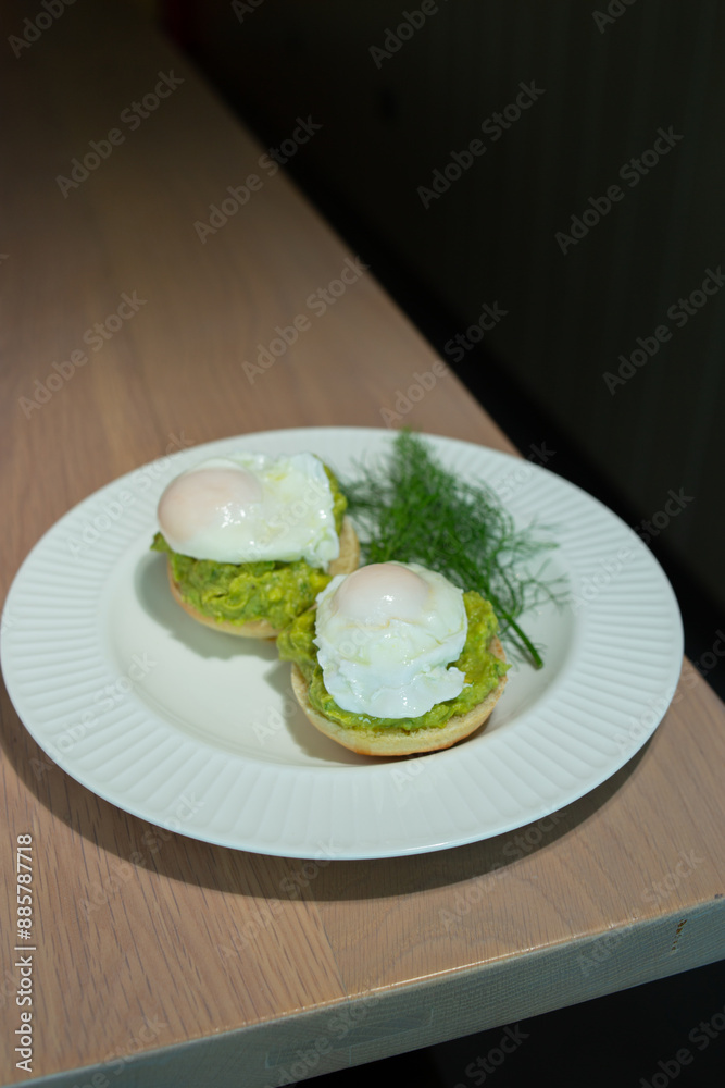 Eggs Benedict and poached eggs on avocado toast. Great for brunch fans and food lovers who want tasty and pretty dishes Eggs Benedict and poached eggs on avocado toast. Great for brunch fans and food lovers who want tasty and pretty dishes