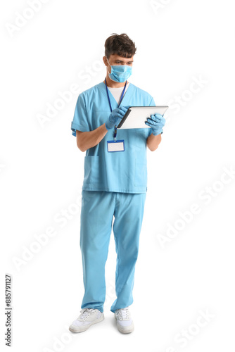 Male medical student with modern tablet computer on white background