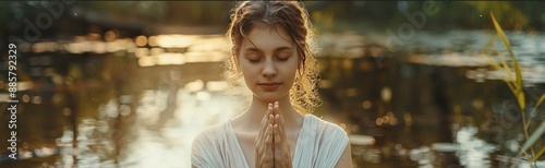 Peaceful Caucasian woman, humbly dressed, hands folded in prayer, surrounded by calming photo