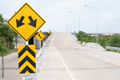 Selective focus of Lane Guidance Signal and Left curve warning sign.Background is concrete road.
