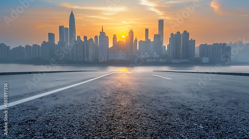 Empty Road Leading to a Modern City Skyline at Sunrise