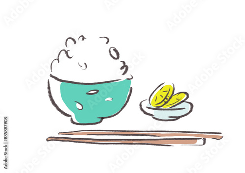 緑の茶碗によそったご飯とたくあんの漬物