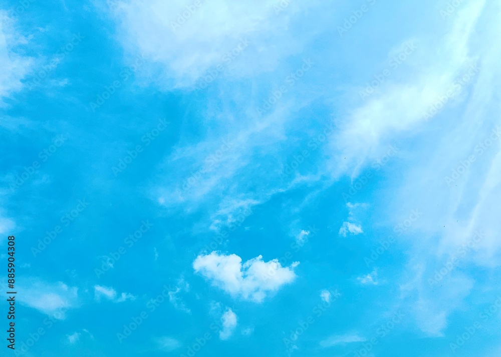 Beautiful and bright blue sunny cloudy sky isolated on horizontal ratio empty copy spaced background. Beautiful and bright blue sunny cloudy sky isolated on horizontal ratio empty copy spaced background.