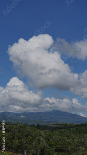 beautiful landscapes bue sky with white cloud, with hills, mountain and forest. at Talang Barisan village, Muara Enim, South Sumatera, Indonesia photo