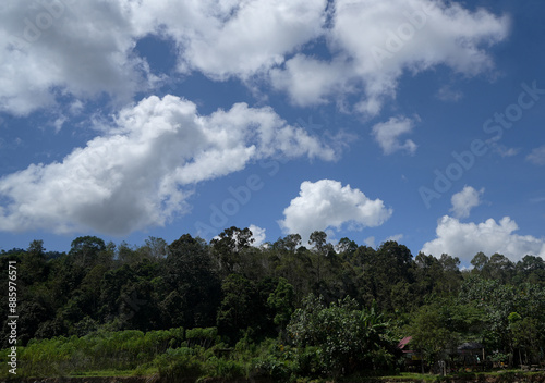 Beautiful scenery landscape blue sky, white cloud, river, tree, forest, hills and mountain, at Muara Enim, South Sumatera, Indonesia photo