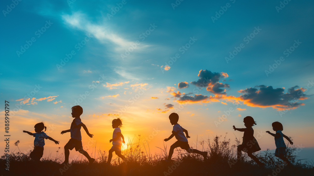 Silhouettes of Children Running Towards the Setting Sun Silhouettes of Children Running Towards the Setting Sun