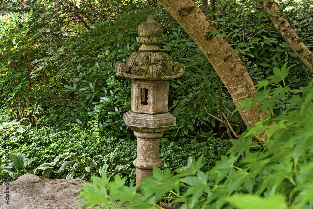 A decorative Japanese Lantern in a lush garden setting in the Bellevue Botanical Garden on a nice late summer day, Washington State, USA_08092009_0104. A decorative Japanese Lantern in a lush garden setting in the Bellevue Botanical Garden on a nice late summer day, Washington State, USA_08092009_0104.