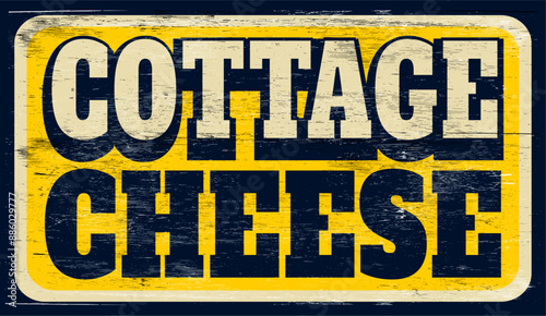 Aged and worn cottage cheese sign on wood