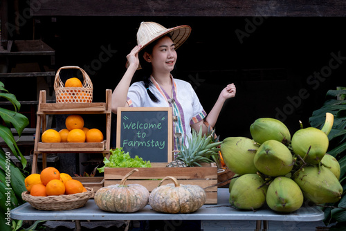 Native Asia woman selling fruits at the farm stay, Homestay at Thailand photo