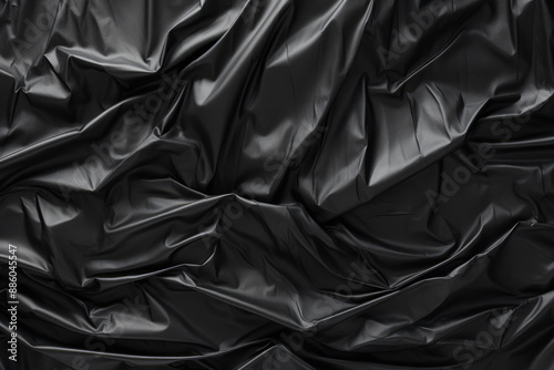 Processed collage of black cellophane garbage bag texture. Background for banner, backdrop