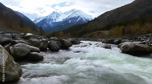 A fast-flowing river in a rocky mountain landscape