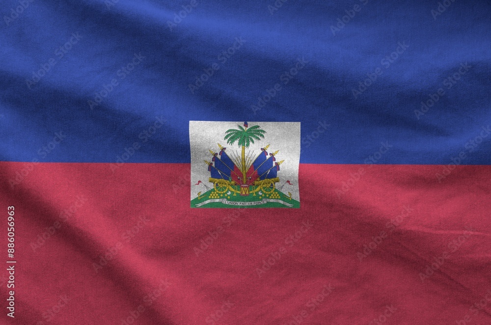 Haiti flag depicted on folded wavy fabric of old cloth close up