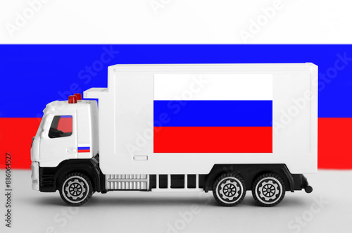 Russia flag depicted on side wall of white delivery van close up. Shipping and local delivery concept