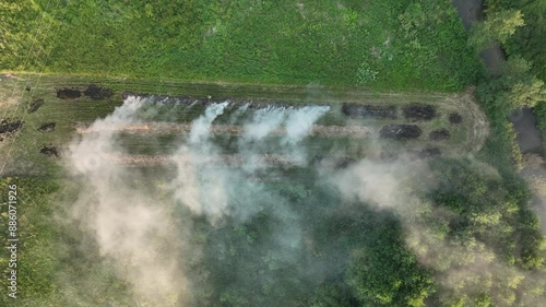 Farmer burning hay, causing smoke in the village, destroying the ecosystem