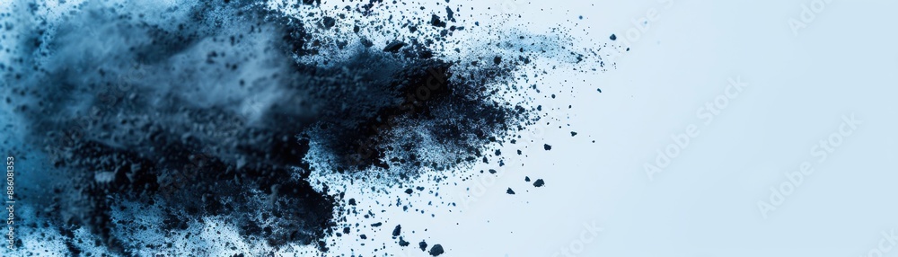 Explosive burst of black powder on a light blue background, creating a dynamic and visually striking abstract image. Ideal for creative projects. Explosive burst of black powder on a light blue background, creating a dynamic and visually striking abstract image. Ideal for creative projects.
