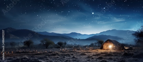 The star shine above the manger in an enchanted night sky, with the mountain view, creating atmosphere of Christmas Eve.