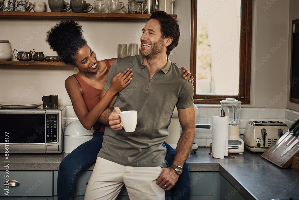 Interracial couple, together and happiness with tea in kitchen for wellness, morning routine or bonding in home. Man, woman and smile in house with coffee for health, relax with partner or care Interracial couple, together and happiness with tea in kitchen for wellness, morning routine or bonding in home. Man, woman and smile in house with coffee for health, relax with partner or care