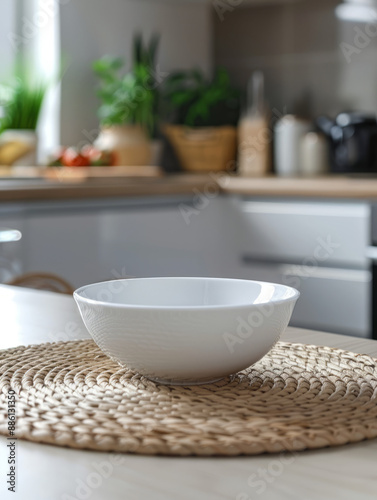 White bowl on woven placemat in a modern kitchen.