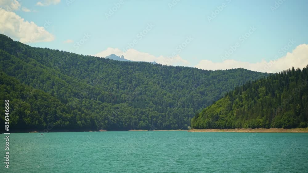 blue-green waters of Lake Bicaz in western Romania, a summertime recreational hotspot blue-green waters of Lake Bicaz in western Romania, a summertime recreational hotspot