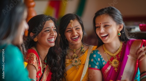 Joyful Indian Women in Traditional Sarees Sharing a Laugh Indoors photo