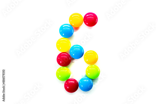 Digit 6 of multicolored rainbow candies isolated on white background. alphabet and numbers