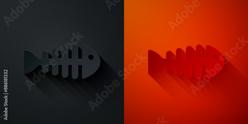 Paper cut Fish skeleton icon isolated on black and red background. Fish bone sign. Paper art style. Vector
