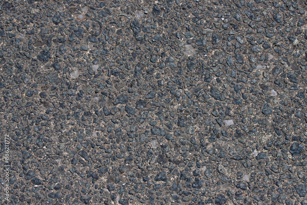 Background texture of gray stone wall with small pebble stones Background texture of gray stone wall with small pebble stones