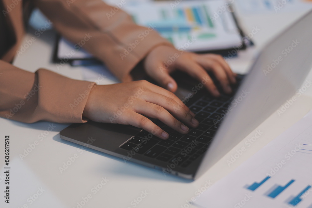 Business woman accountant working audit and calculating expense financial annual financial report balance sheet statement, doing finance making notes on paper checking document.