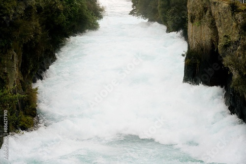 Water rages wildly in the river, The Huka Falls, Waikato River photo