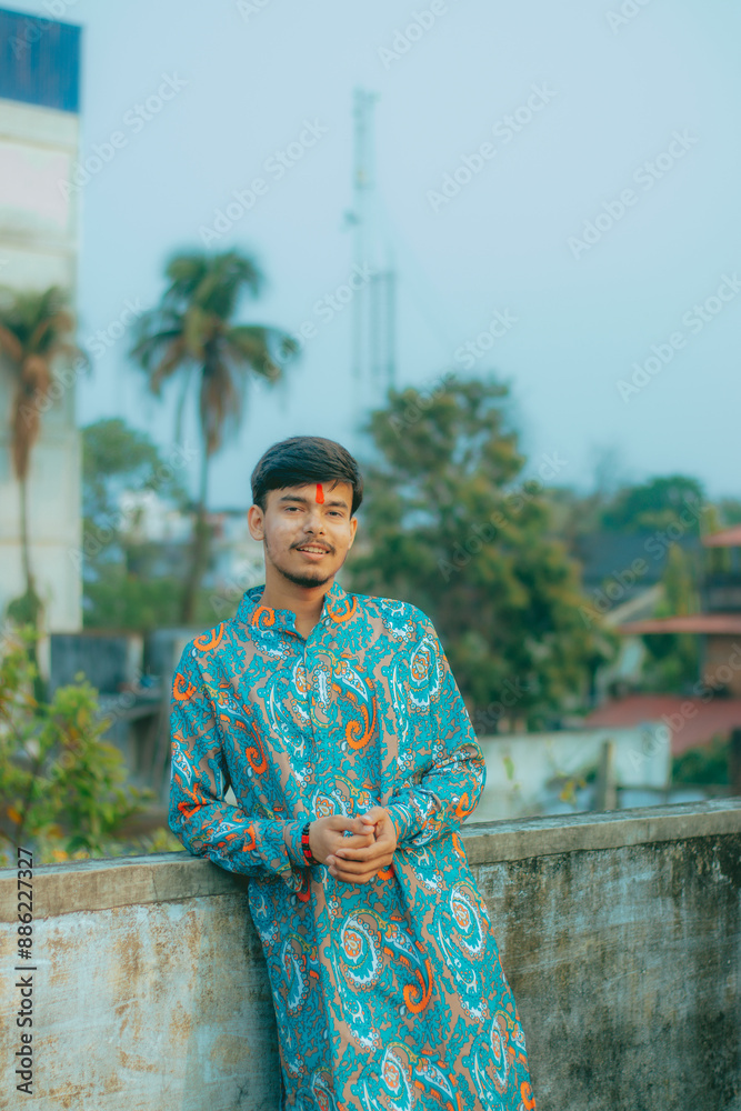 Fototapeta premium Picture of a Male Model posing outdoor. Man posing in creative lighting.