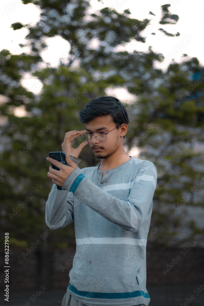 Picture of a Male Model posing outdoor. Man posing in creative lighting. Picture of a Male Model posing outdoor. Man posing in creative lighting.