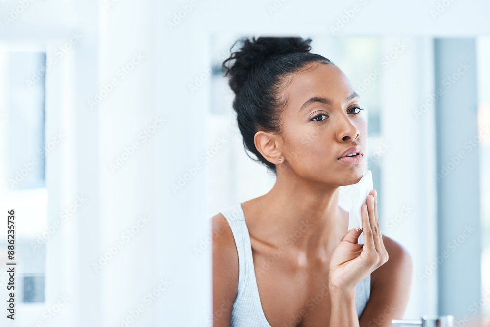 Home, mirror and girl with cotton for skincare, makeup removal and cleansing for wellness in bathroom. Woman, cosmetics and product for cleaning, facial treatment and swab pad by reflection in house Home, mirror and girl with cotton for skincare, makeup removal and cleansing for wellness in bathroom. Woman, cosmetics and product for cleaning, facial treatment and swab pad by reflection in house