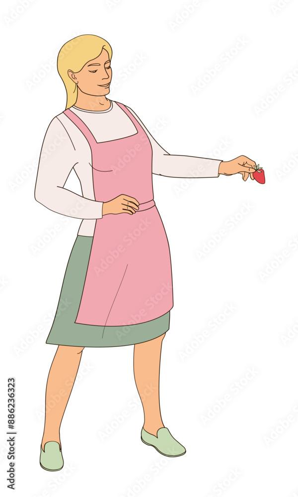 standing woman in an apron with strawberries in hand standing woman in an apron with strawberries in hand