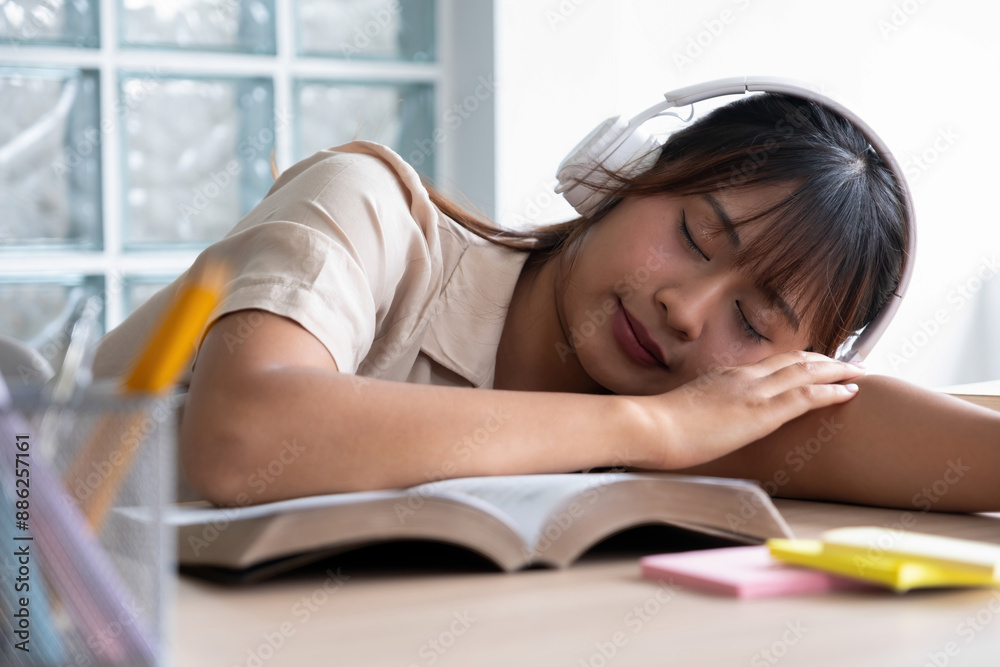 Woman is taking a break from study or work. Woman is taking a break from study or work.