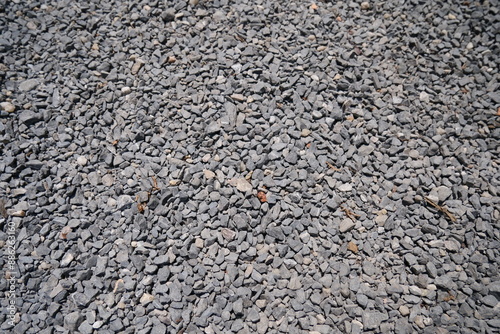 An intricate grayscale pattern of textured stone and concrete surfaces, depicting a blend of natural and industrial materials