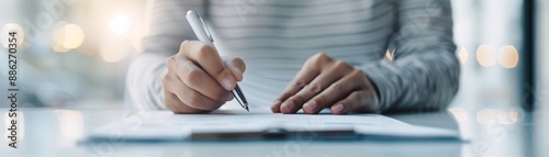 Close-up of an advisor writing notes on a financial document, emphasizing professional expertise and meticulous planning, with ample copyspace for messaging.