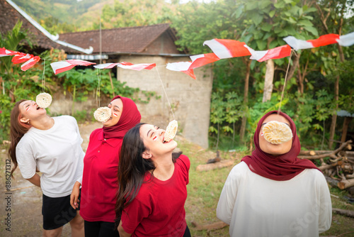 A group of women are eating creakers contest photo