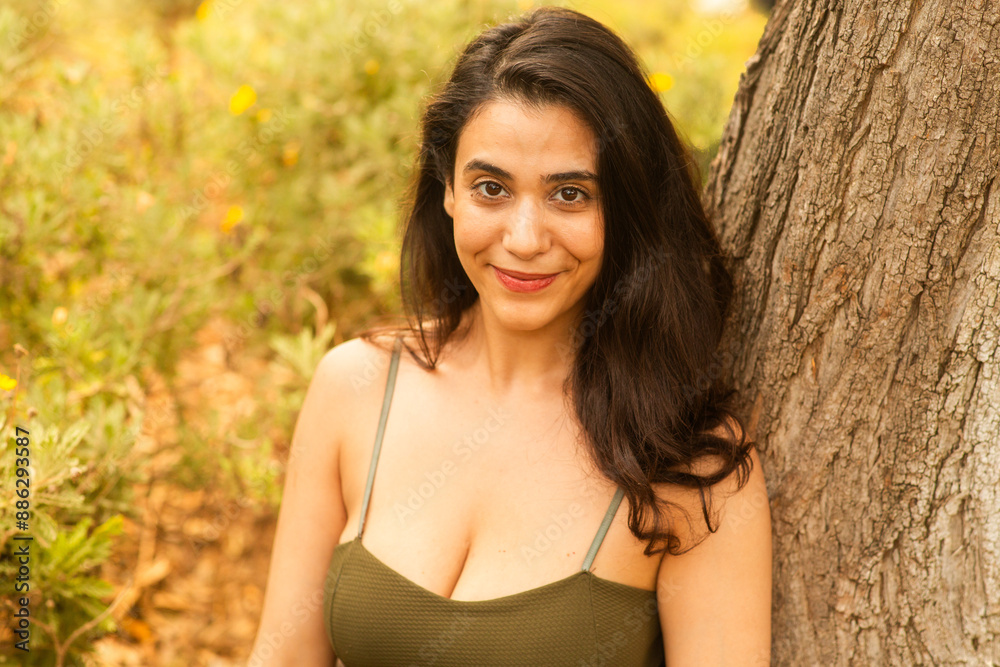 woman relaxing in the park with beautiful smile woman relaxing in the park with beautiful smile