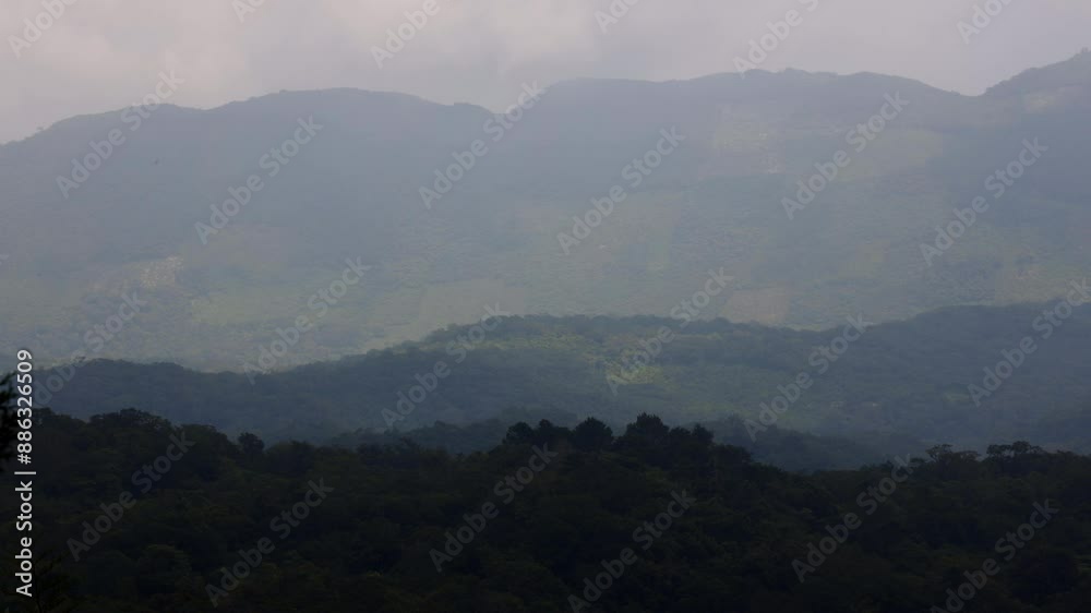 Clouds shadow and mist clearing over dense rainforest canopy in Mexico, Huasteca Potosina