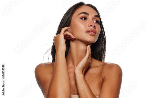 Face building massage. Portrait of beautiful young woman with perfect face lines, tanned spotless skin isolated on white background. Female beauty, skin and body care, cosmetology, cosmetics concept