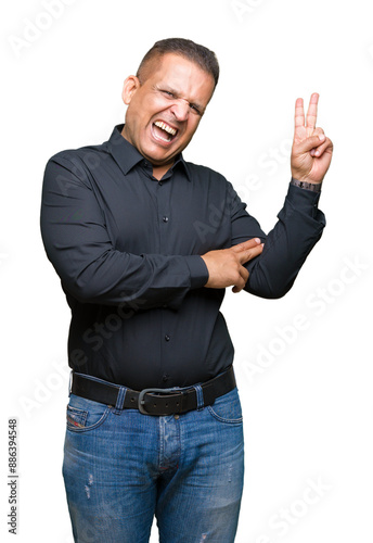 Handsome middle age arab business man over isolated background smiling with happy face winking at the camera doing victory sign. Number two.